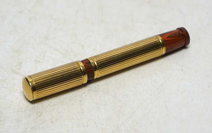 A Watermans Ideal red ripple hard rubber safety pen with Orix gold plated overlay. Condition - good, red a little faded